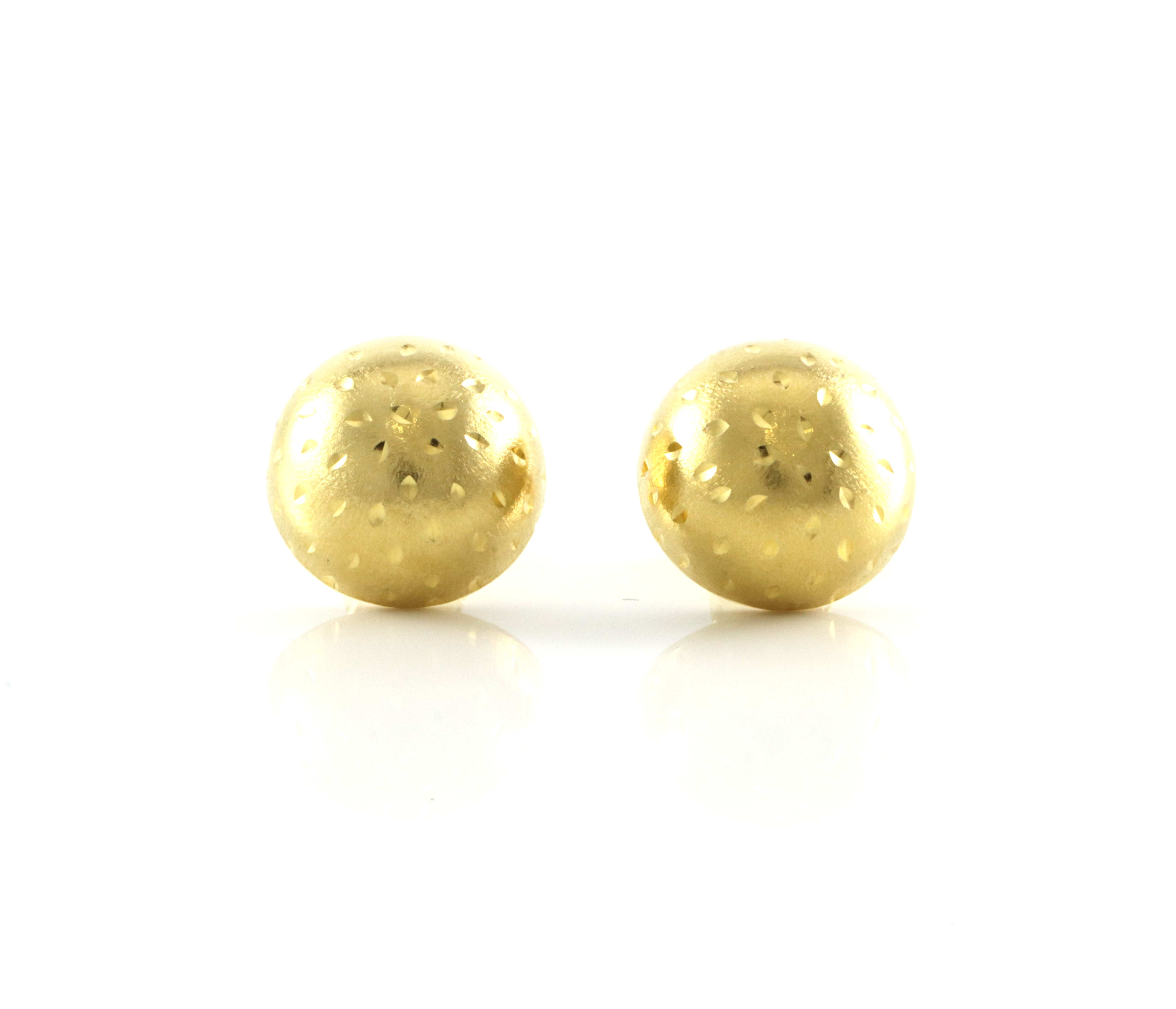 Store halvkuler med gravert mønster. Øredobber